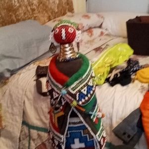 Hand made African doll with beaded clothes